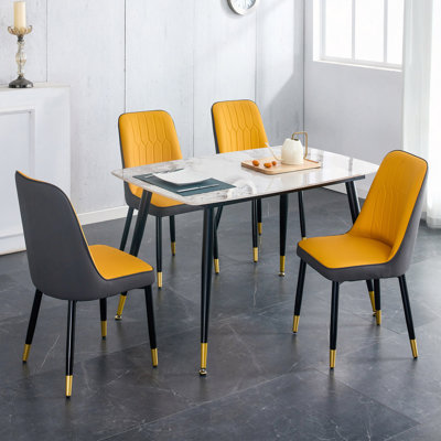 Ensemble de table et de chaises, plateau de table en pierre frittée à motifs avec pieds en métal, coussin de dossier en polyuréthane orange-jaune et gris et chaise en métal, 1 table et 4 chaises