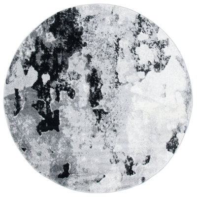Tapis gris / noir en polypropylène tissé à la machine à motif abstrait Leonaldo