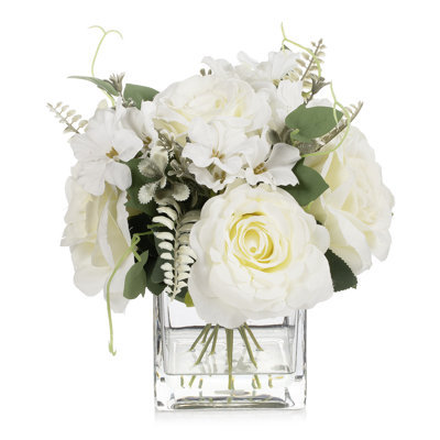 Arrangement de fleurs artificielles roses dans un vase en verre avec de l'eau artificielle (crème)