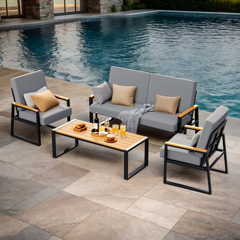Ensemble de conversation de patio 4 pièces avec coussins, causeuse à structure en métal, 2 fauteuils et table basse d'apparence bois