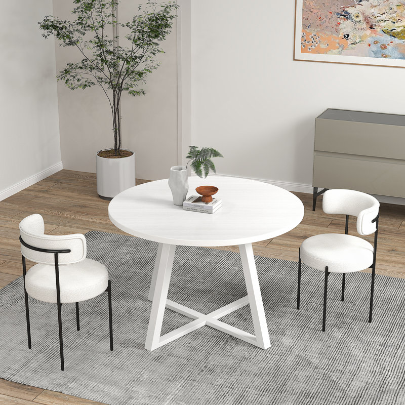 Ensemble de table à manger trois pièces avec chaises confortables et table ronde, idéal pour les réunions de famille et les espaces de salle à manger modernes