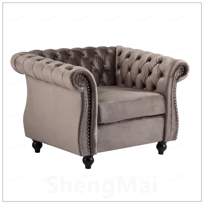 Fauteuil club Chesterfield avec capitonnage à boutons profonds et accoudoirs roulés, rembourré pour plus de confort et d'élégance