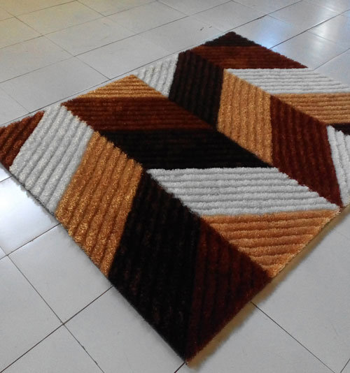 Tapis brun / orange tissé à la machine, 5 pi 3 po x 7 pi 2 po