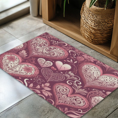 Tapis tressé cœur-rose