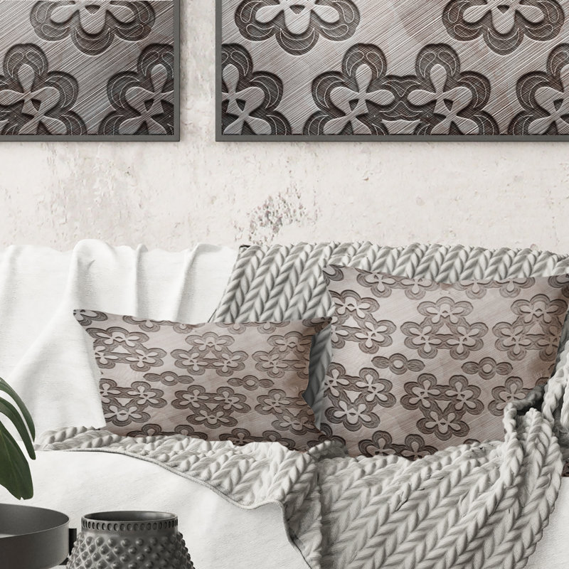 Coussin décoratif gris à motif de fleurs grises