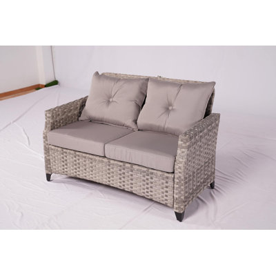 Woodrum 50" Wide Outdoor Wicker Loveseat with Cushions