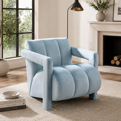 Fauteuil contemporain en velours capitonné, accoudoirs larges, structure en acacia et contreplaqué