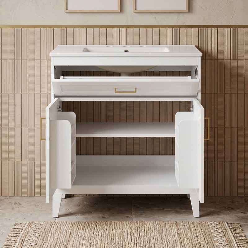 Meuble-lavabo minimaliste sur pied avec lavabo en céramique, tiroir basculant, tablette réglable et portes à fermeture douce.