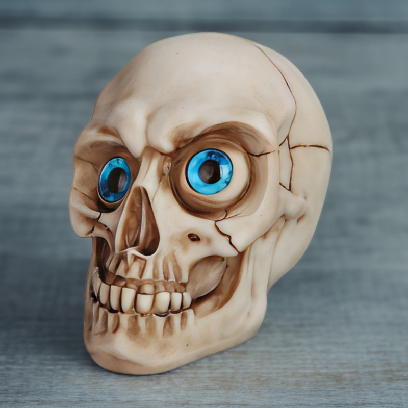 Figurine tête de mort l 5 "avec œil bleu