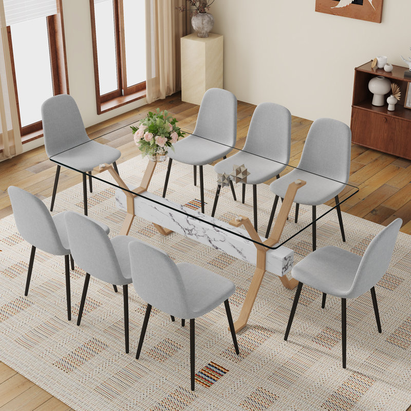 Ensemble de table de salle à manger élégant avec plateau en verre et chaises en lin pour les réunions de famille et les événements sociaux