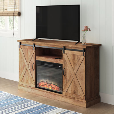 Montanez Unfinished TV Stand for TVs up to 55" with Fireplace Included