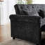 Lit tapissier gris foncé avec accoudoirs coussinés et sac de rangement revêtu de tissu