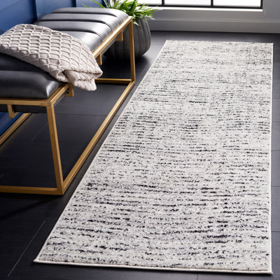 Riebe Abstract Ivory/Silver Area Rug