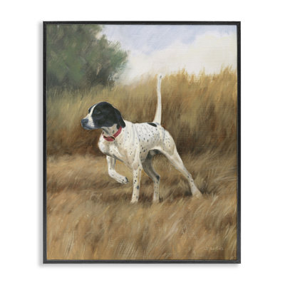 Chien pointeur dans un champ