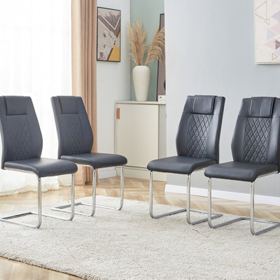 Chaises de salle à manger chic avec siège en cuir PU doux et pieds en métal - de 4 en noir pour le salon, la chambre à coucher, les espaces et le cadre