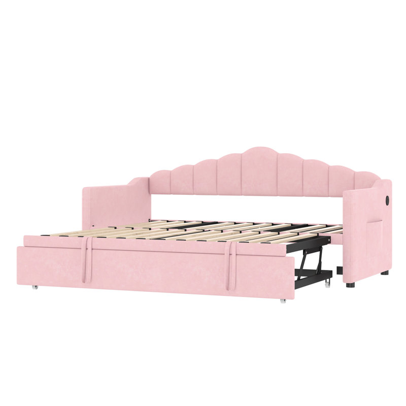 Lit de jour simple en tissu d'ameublement rose avec couchette escamotable escamotable, port de charge intégré et station de jour ajustable pour deux magazines