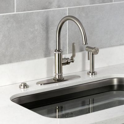 Kingston Brass Whitaker Single-Handle Deck Mount Kitchen Faucet with Brass Sprayer