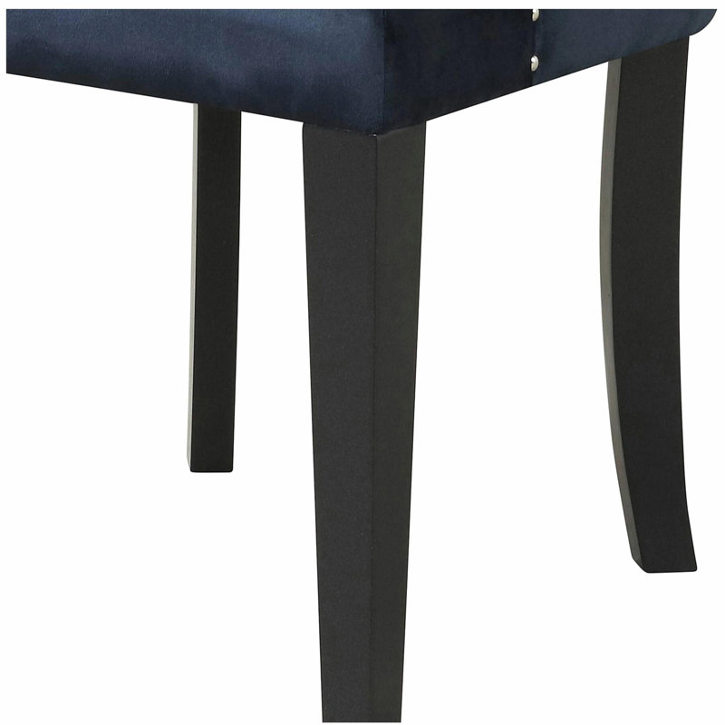 Fauteuil capitonné à dossier
