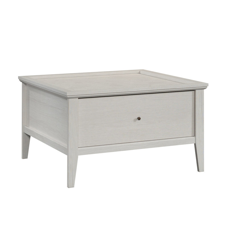 Table basse grise offrant un tiroir lisse, un design élégant et un placement flexible - idéal pour la présentation
