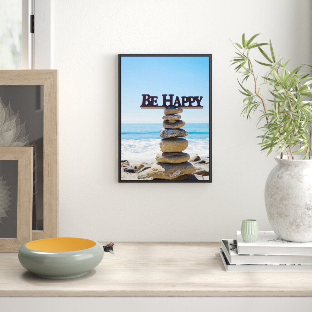 Gerahmtes Wandbild Steinturm am Strand