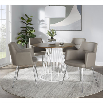 Table de salle à manger ronde à assembler soi-même, avec piètement en tréteaux blanc et plateau en bois pour quatre personnes.