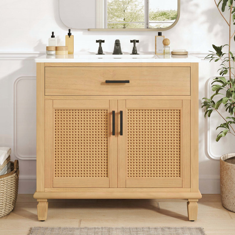 Meuble-lavabo en rotin avec lavabo en céramique et portes artisanales