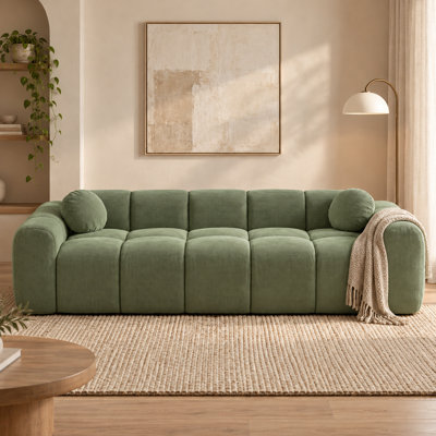 Canapé Cloud contemporain en velours côtelé avec assise profonde et rembourrée, accoudoirs arrondis, coussins assortis et emballage compressible, idéal pour salon, appartement, studio et lounge.
