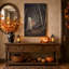 Tableau sur toile d'Halloween représentant un fantôme blanc tenant une lanterne dans une forêt sombre-608648226
