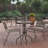 Amlie 23.75" Round Tempered Glass Metal Table with Smooth Ripple Design Top-1557178483