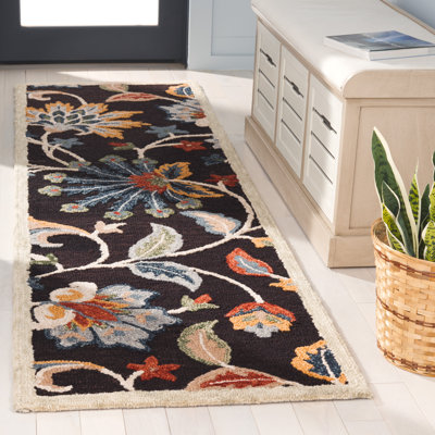 Tapis floral brun en laine Deaquaneil