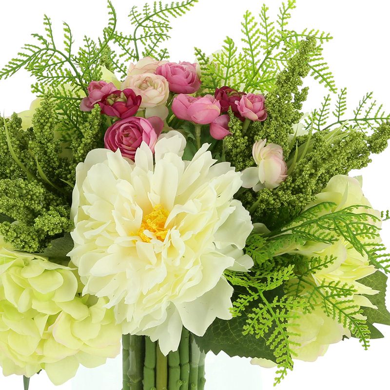 Peony, Hydrangea And Ranunculus Floral Arrangement In A Clear Glass Vase