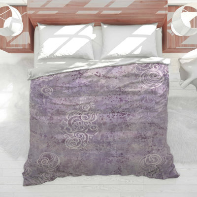 Édredon mauve à motif abstrait
