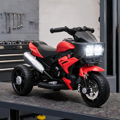 Moto électrique pour tout-petits à 3 roues, enfants en acier PP de couleur rouge, pneus à traction élevée, marche avant / arrière, musique, klaxon, phares
