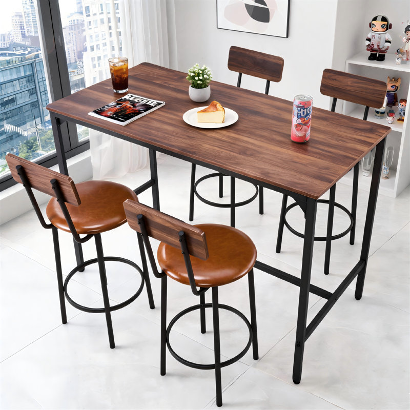 The Walnut Wood And Black Five-Piece Bar Table And Chair Set Features A Long Table With Four Bar Stools, And The Rounded Corners Make It Suitable For Various Settings Including The Dining Room, Kitchen, And Living Room.