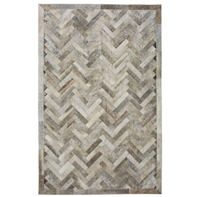 Tapis à chevrons en cuir fait à la main Plutus