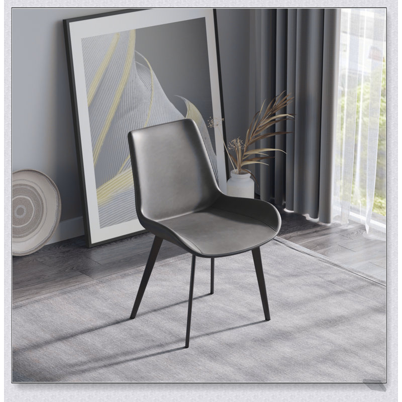 Chaise de salle à manger moderne avec dossier ergonomique et pieds élégants en métal noir pour une assise confortable