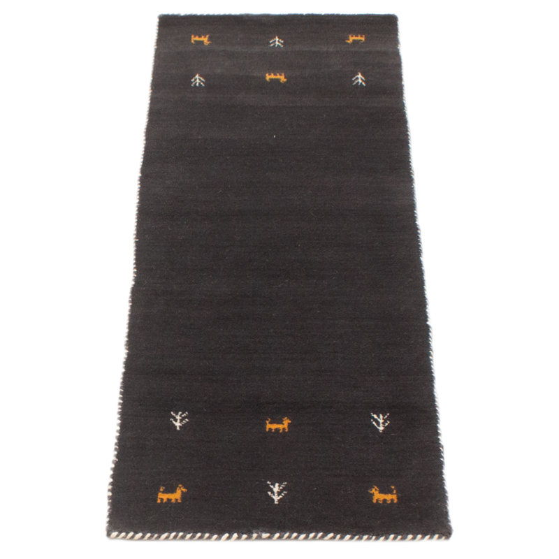 Les tapis Gabbeh sont fabriqués à la main avec des poils très hauts et des motifs très simples et stylisés.