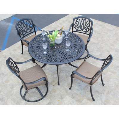 Weaubleau 4 - Person Patio Dining Set Umbrella Hole Included Round Table with Cushions Included