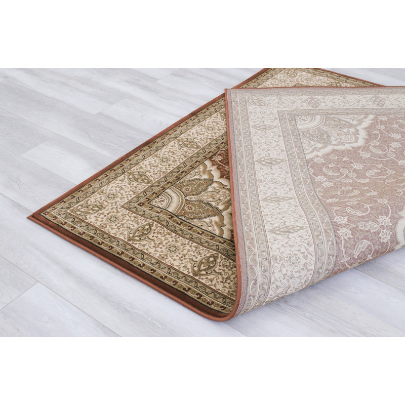 Harpersville Oriental Area Rug in Brown/Ivory