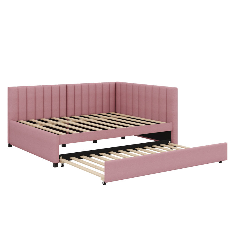 A Full-Sized Upholstered Daybed Incorporating A Built-In Trundle Bed, Pink