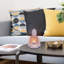 Ensemble de 2 bougies chauffe-plat statues de Bouddha en composite Bungalow Rose