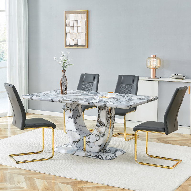 Ensemble de table de salle à manger moderne avec plateau en panneau de fibres à densité moyenne texturé blanc et bordure dorée, base en forme de U, chaises en similicuir incluses