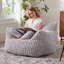 Pouf moderne en fausse fourrure pour le salon et la chambre-222424843-202682716