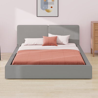 Lit tapissier moderne avec tête de lit en tissu épais et plateforme élégante