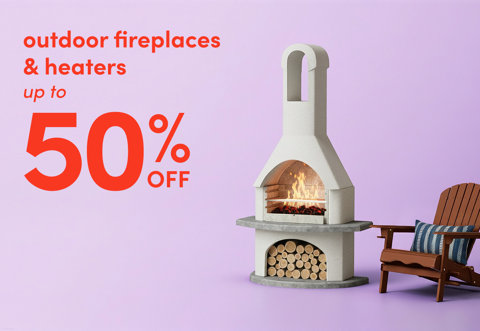 Outdoor fireplaces and heaters up to 50% off, featuring a stone outdoor fireplace with a fire burning and a wooden Adirondack chair beside it.