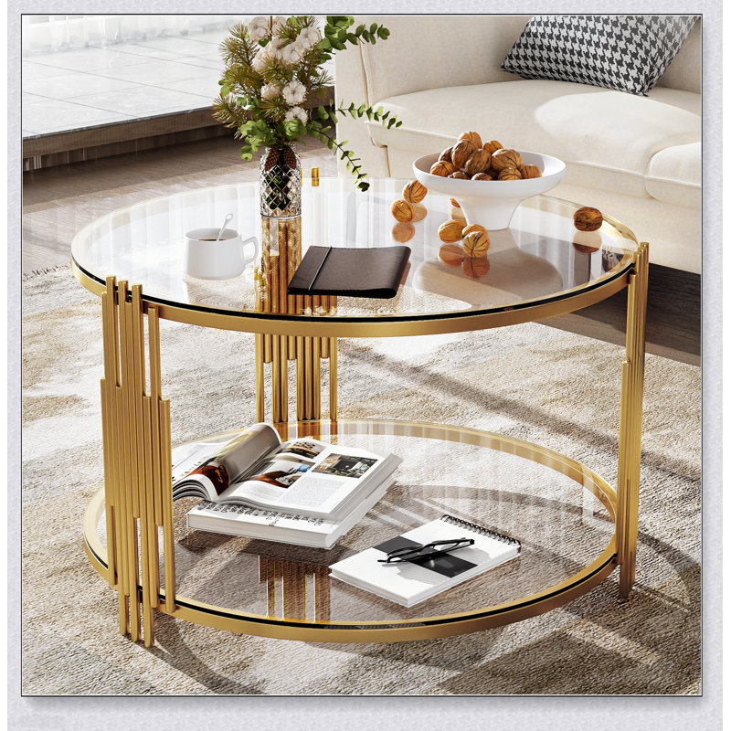 Table basse moderne en verre avec structure asymétrique en métal et base cylindrique, parfaite pour les espaces de vie contemporains