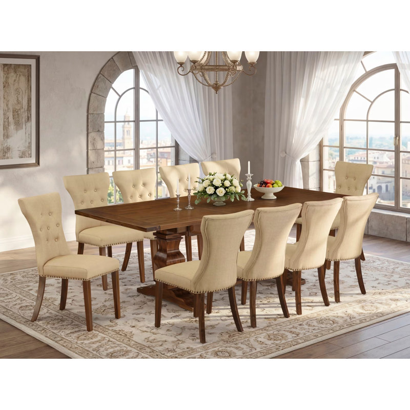 L'ensemble de table de salle à manger 11 pièces comprend une table de cuisine rectangulaire avec rallonge amovible et 10 chaises de salle à manger Parson en tissu brun, noyer antique