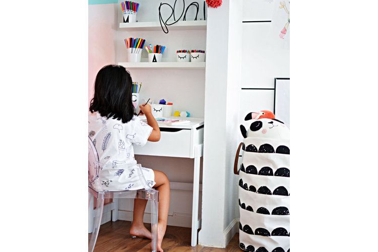 A white bedroom with pink accents