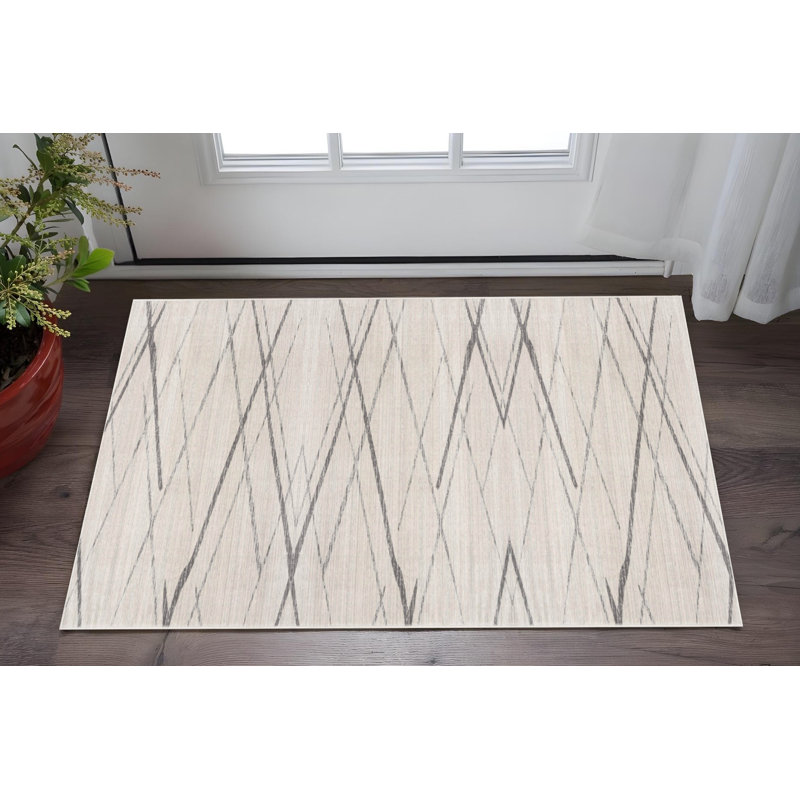 2' X 5' Beige And Gray Abstract Area Rug