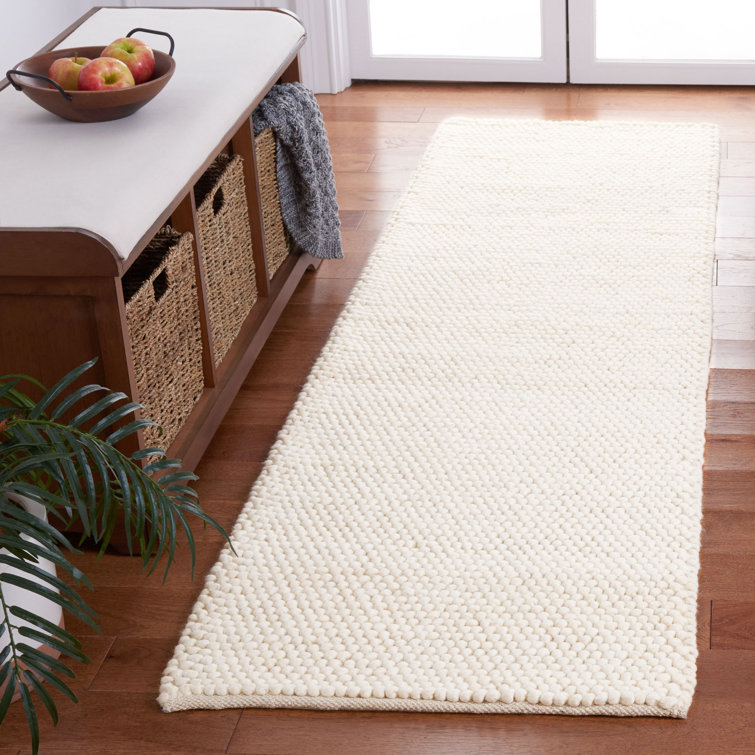 Charvik Solid Color Handmade Area Rug in Ivory